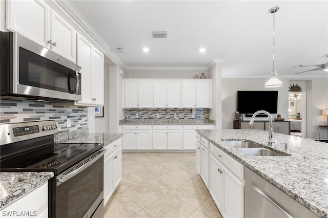 kitchen featuring white cabinets, sink, stainless steel appliances, and ornamental molding