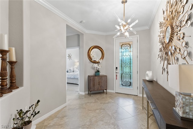 foyer with ornamental molding and an inviting chandelier