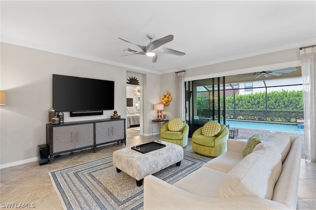 living room featuring ceiling fan and ornamental molding