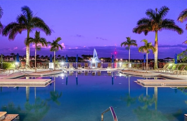 pool at dusk with a water view