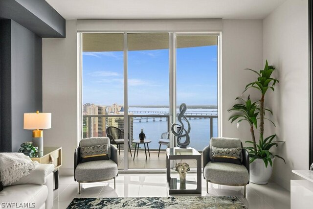 3000 Oasis Grand Blvd Unit Mph3, Fort Myers, FL 33916 - living area with a water view and floor to ceiling windows