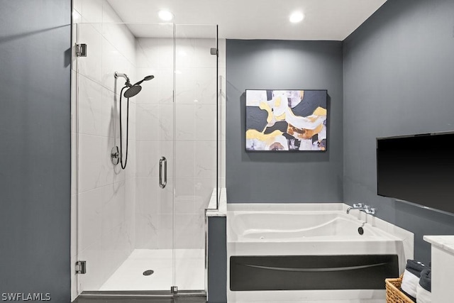 3000 Oasis Grand Blvd Unit Mph3, Fort Myers, FL 33916 - bathroom with a garden tub, a shower stall, and recessed lighting