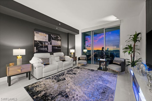 living room featuring floor to ceiling windows and tile patterned floors