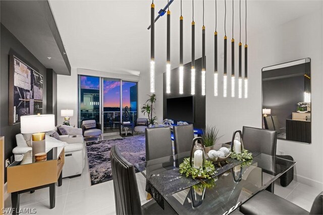 tiled dining area featuring a wall of windows