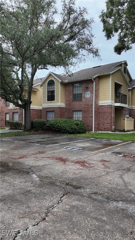 view of front of property with a balcony