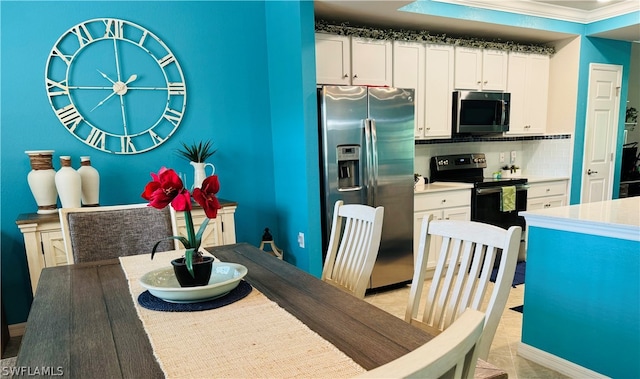 dining room featuring ornamental molding