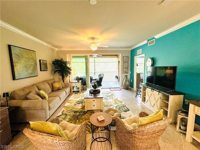 tiled living room with ceiling fan, ornamental molding, and a textured ceiling