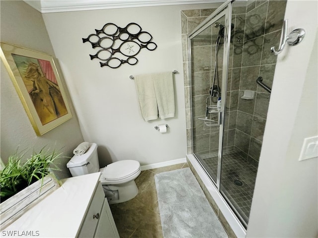 bathroom with toilet, crown molding, walk in shower, and vanity