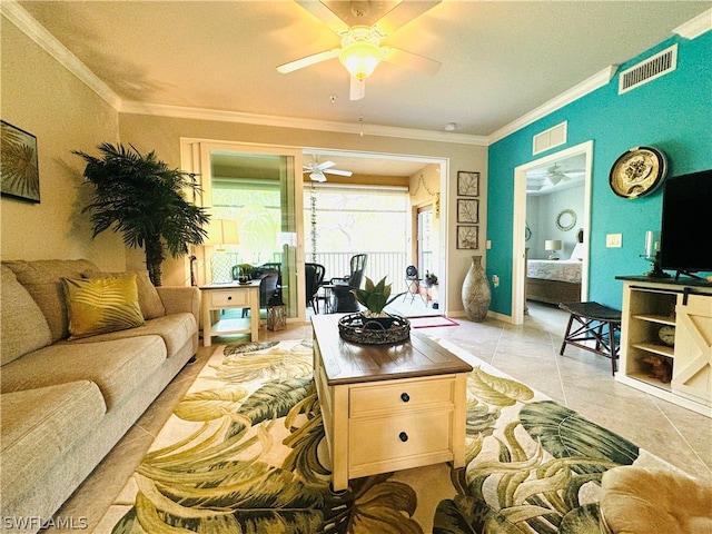 tiled living room with crown molding and ceiling fan