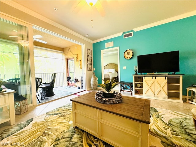 tiled living room with ceiling fan and crown molding