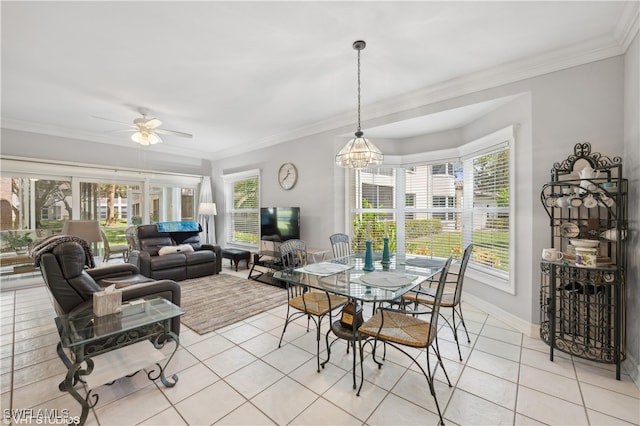 tiled dining room featuring ceiling fan with notable chandelier and crown molding