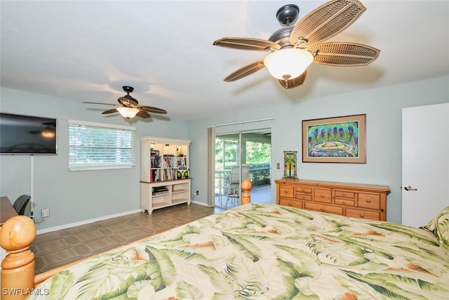 tiled bedroom with multiple windows, ceiling fan, and access to exterior