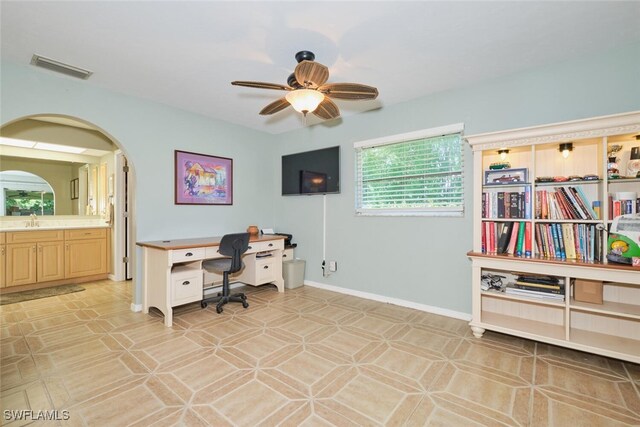 tiled home office with sink and ceiling fan