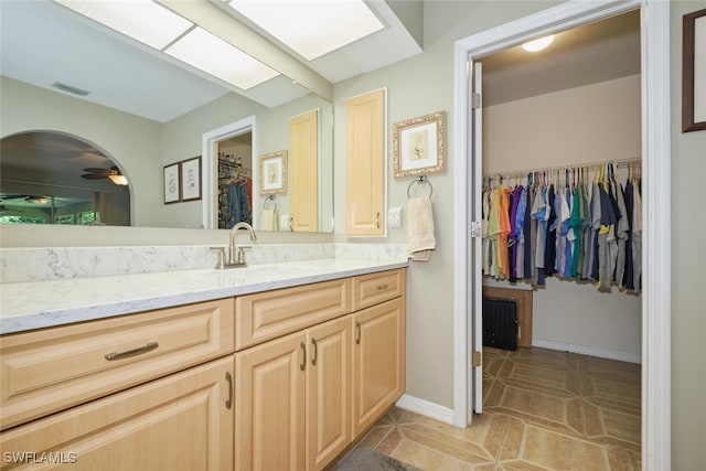 bathroom with tile patterned flooring and vanity