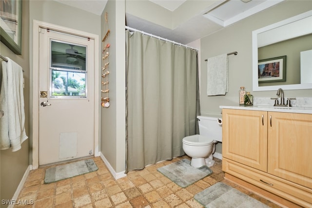 bathroom with vanity, toilet, and tile patterned flooring