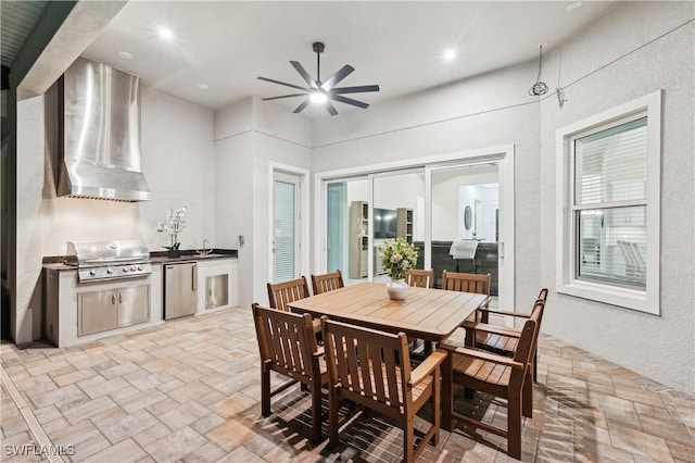 dining space with sink and ceiling fan