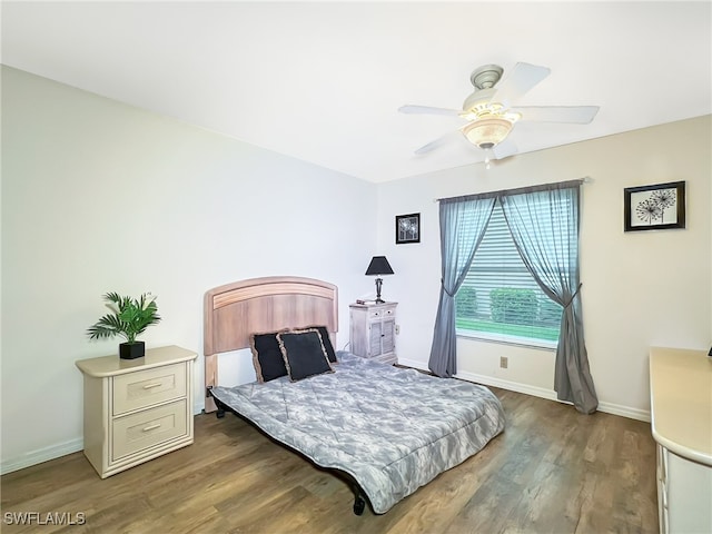 bedroom featuring hardwood / wood-style floors and ceiling fan