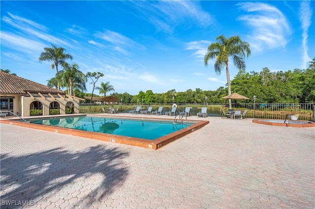 view of swimming pool featuring a patio