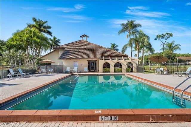 view of swimming pool featuring a patio area