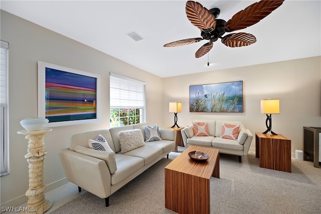 living room featuring ceiling fan and light colored carpet