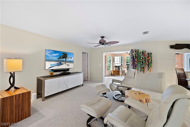 1303 Wahoo Ct, Naples, FL 34102 - living room featuring a ceiling fan and carpet