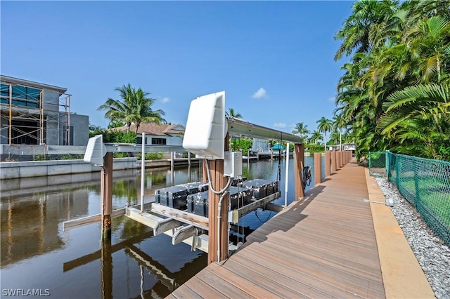 1303 Wahoo Ct, Naples, FL 34102 - dock area featuring boat lift and a water view
