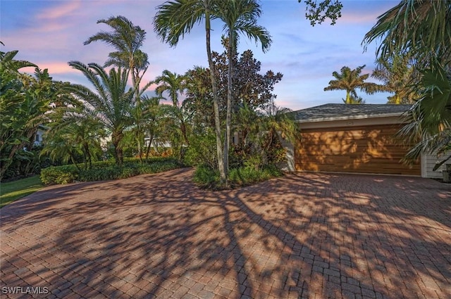 1303 Wahoo Ct, Naples, FL 34102 - view of patio terrace at dusk