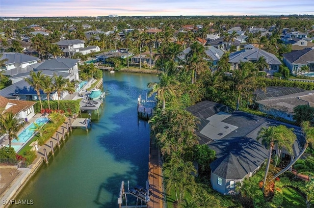 1303 Wahoo Ct, Naples, FL 34102 - aerial view of property's location with nearby suburban area and a nearby body of water