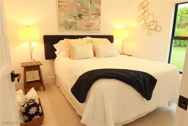 bedroom with light hardwood / wood-style flooring