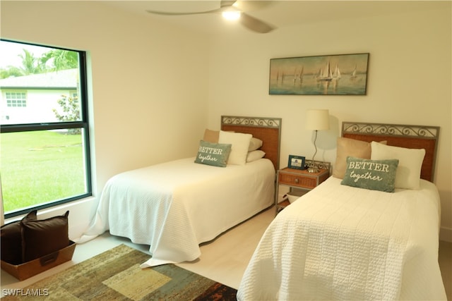 bedroom with ceiling fan and light hardwood / wood-style floors