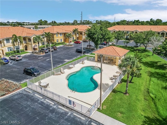 view of swimming pool featuring a yard and a patio