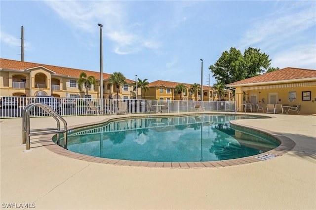 view of swimming pool featuring a patio area