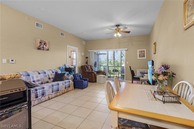 tiled dining room with ceiling fan