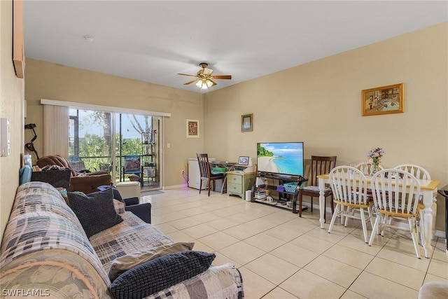 living room featuring ceiling fan and light tile patterned flooring