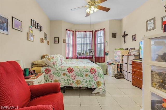 tiled bedroom with ceiling fan