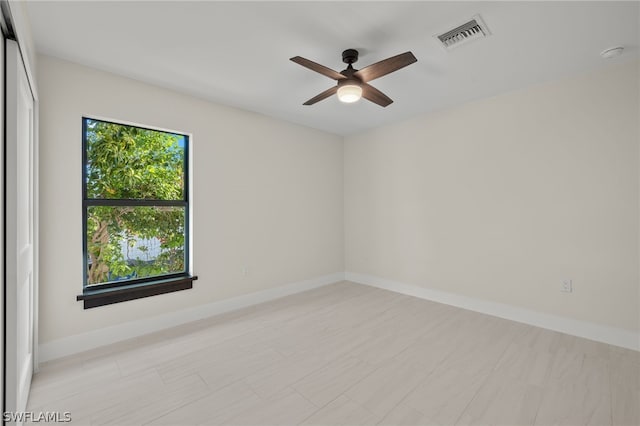 spare room with ceiling fan