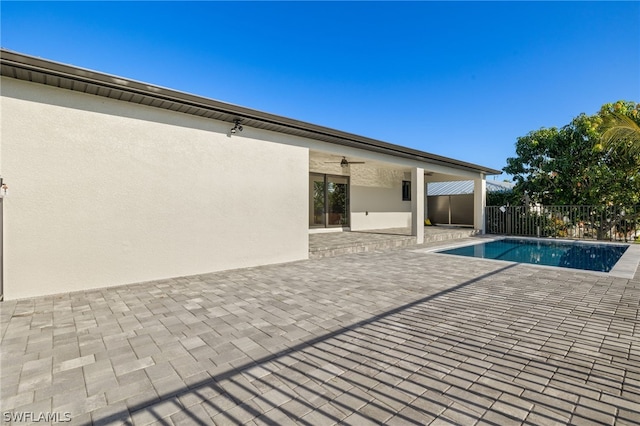 view of pool featuring a patio and ceiling fan