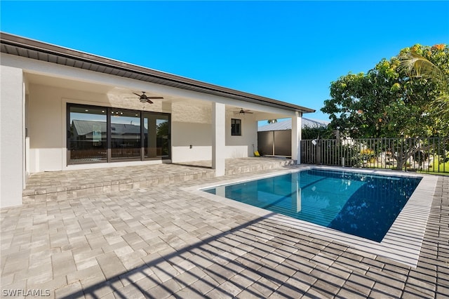 view of pool featuring ceiling fan and a patio area