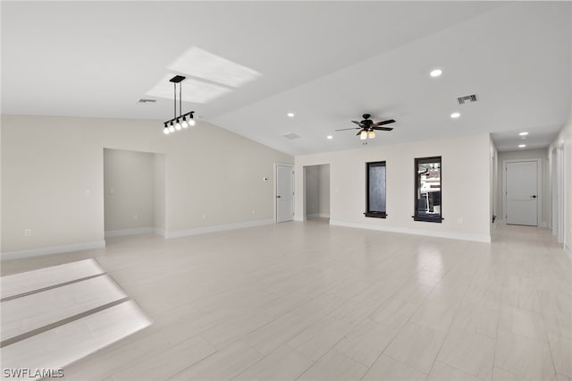 unfurnished living room featuring vaulted ceiling and ceiling fan