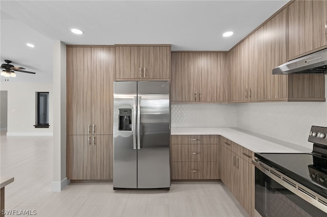 kitchen with tasteful backsplash, ceiling fan, stainless steel appliances, and ventilation hood