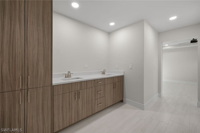 12230 Matlacha Blvd, Matlacha Isles, FL 33991 - bathroom with double vanity, recessed lighting, and baseboards