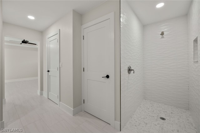 bathroom featuring a tile shower