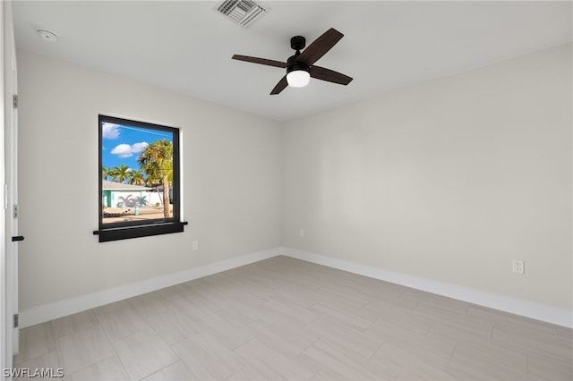 spare room with ceiling fan