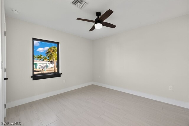 12230 Matlacha Blvd, Matlacha Isles, FL 33991 - unfurnished room with a ceiling fan, baseboards, and a smoke detector