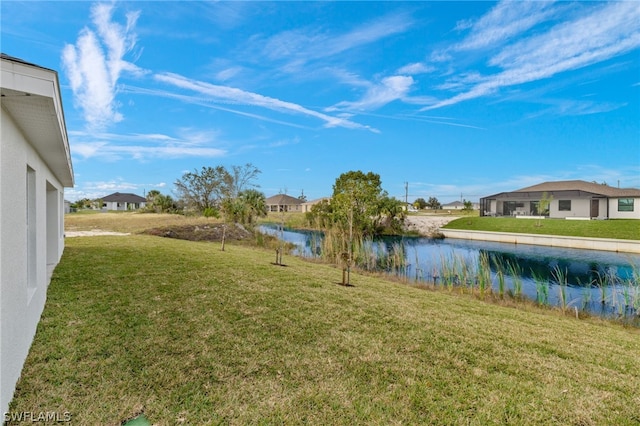 view of yard with a water view