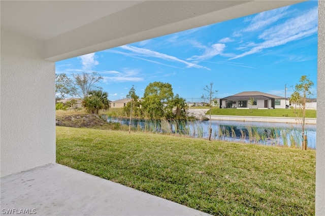 view of yard with a water view