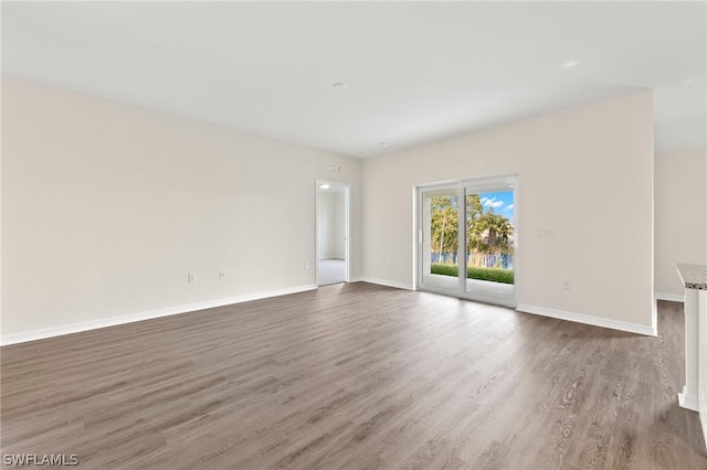 empty room featuring dark hardwood / wood-style floors