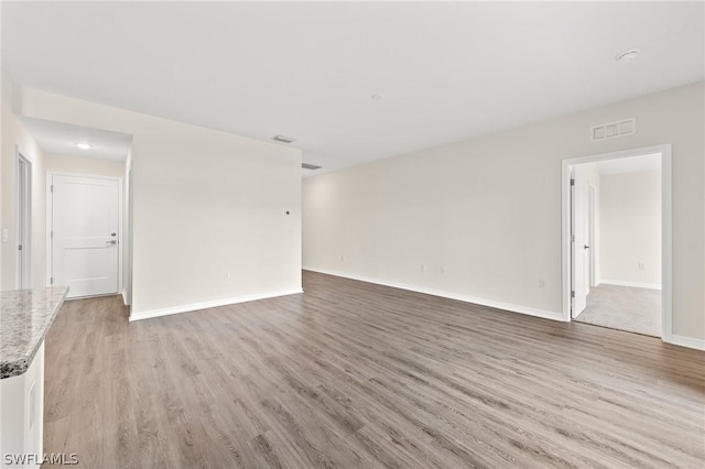 unfurnished living room with light wood-type flooring