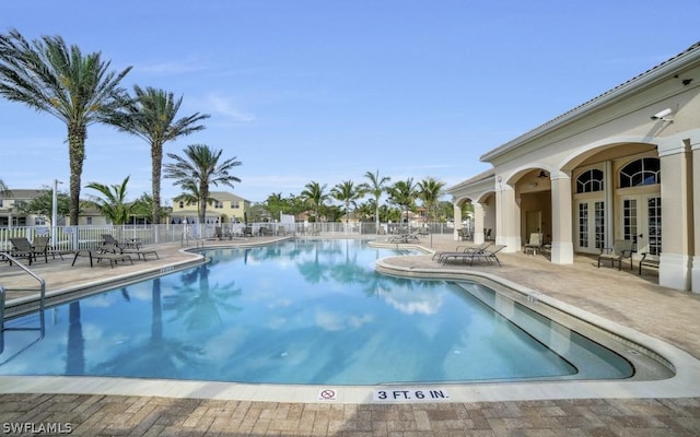 view of swimming pool featuring a patio area