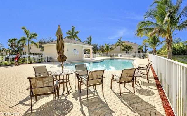 view of swimming pool featuring a patio area